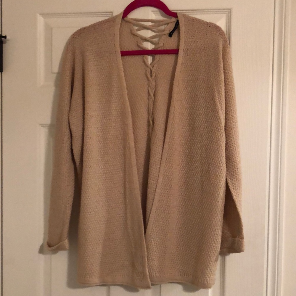 Women’s Size Small blush colored cardigan with back detailing.
